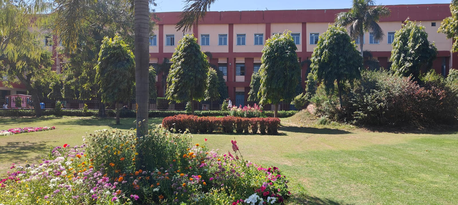 ARSD College main academic block behind the front lawns and flower beds