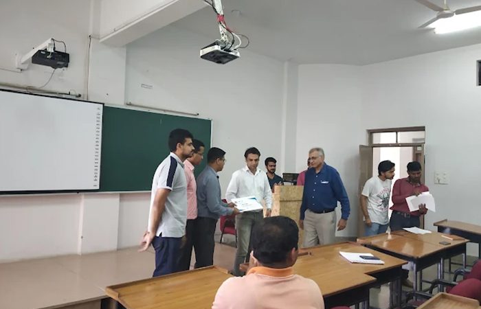 Certificates being handed out at the end of a course on campus