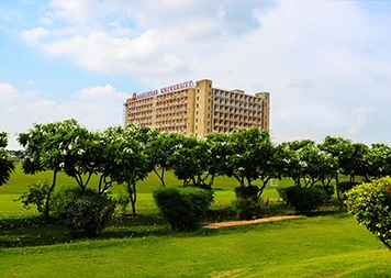 The main academic block at Galgotias University seen across the campus lawns