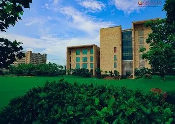 An academic block at Galgotias University framed by campus planting