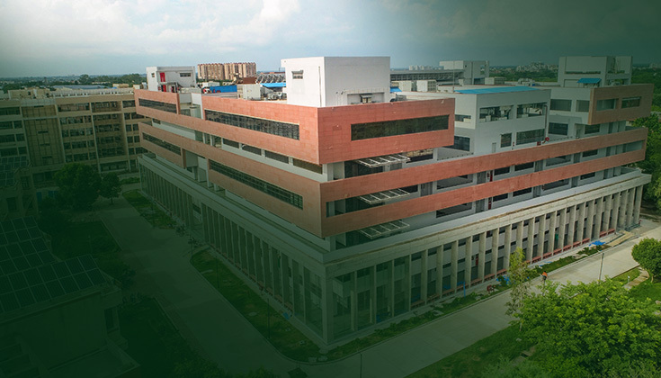 Aerial view of an academic building on the IIT Kanpur campus