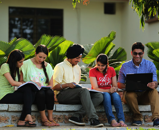 Students studying together on the Manipal campus