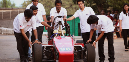 Manipal Institute of Technology students with a Formula-style project vehicle
