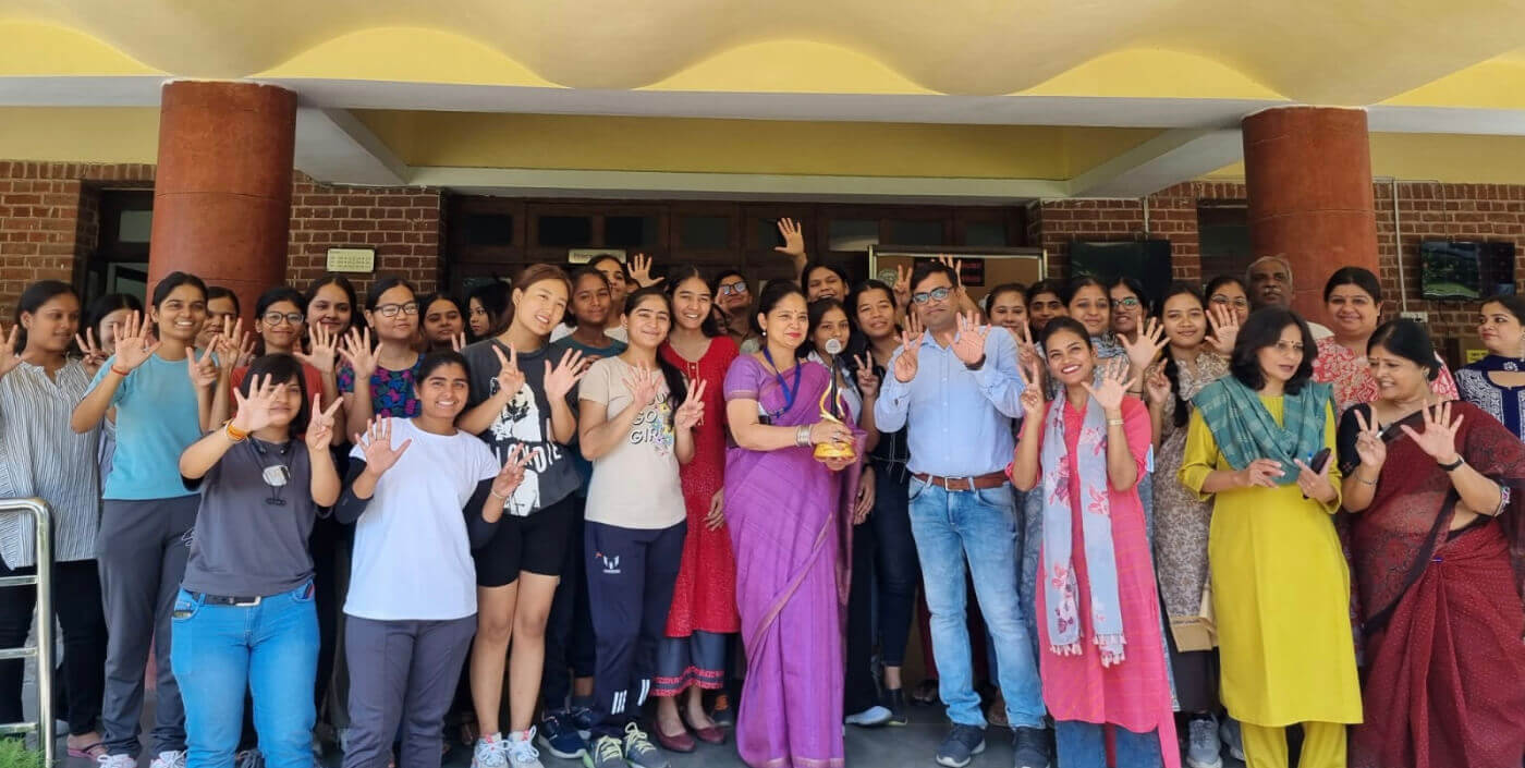 Students and faculty at the entrance to a Miranda House building