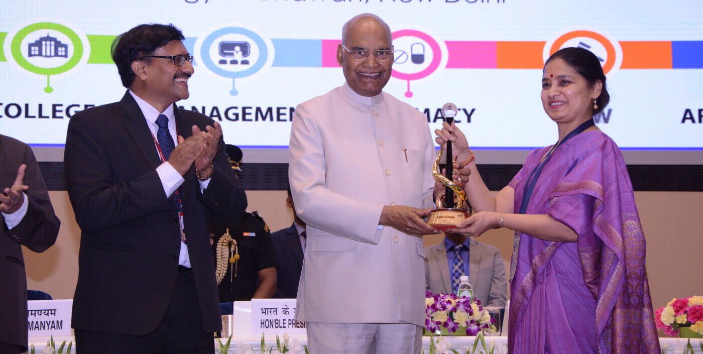 The Principal receiving a national institutional ranking award at the awards ceremony