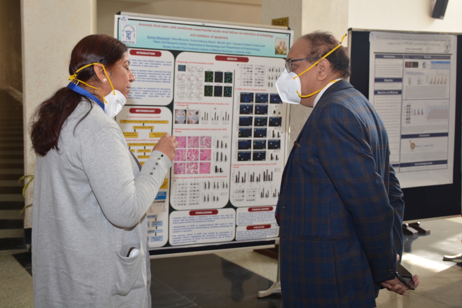 Faculty reviewing scientific posters during Research Day at SGPGIMS Lucknow
