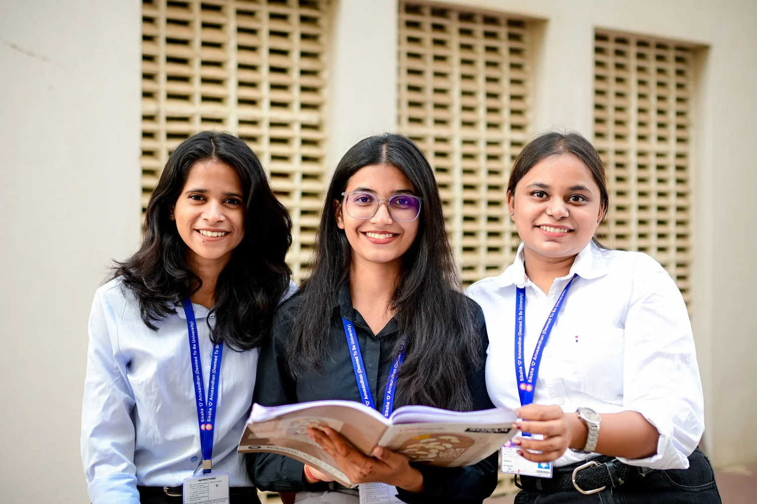 Students in Siksha 'O' Anusandhan identity lanyards on campus