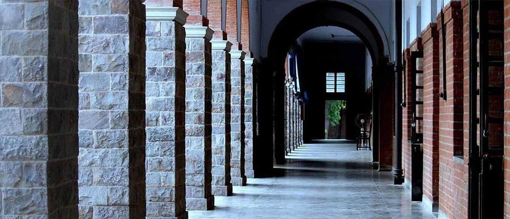 The stone-and-brick cloistered corridor at St. Stephen's College